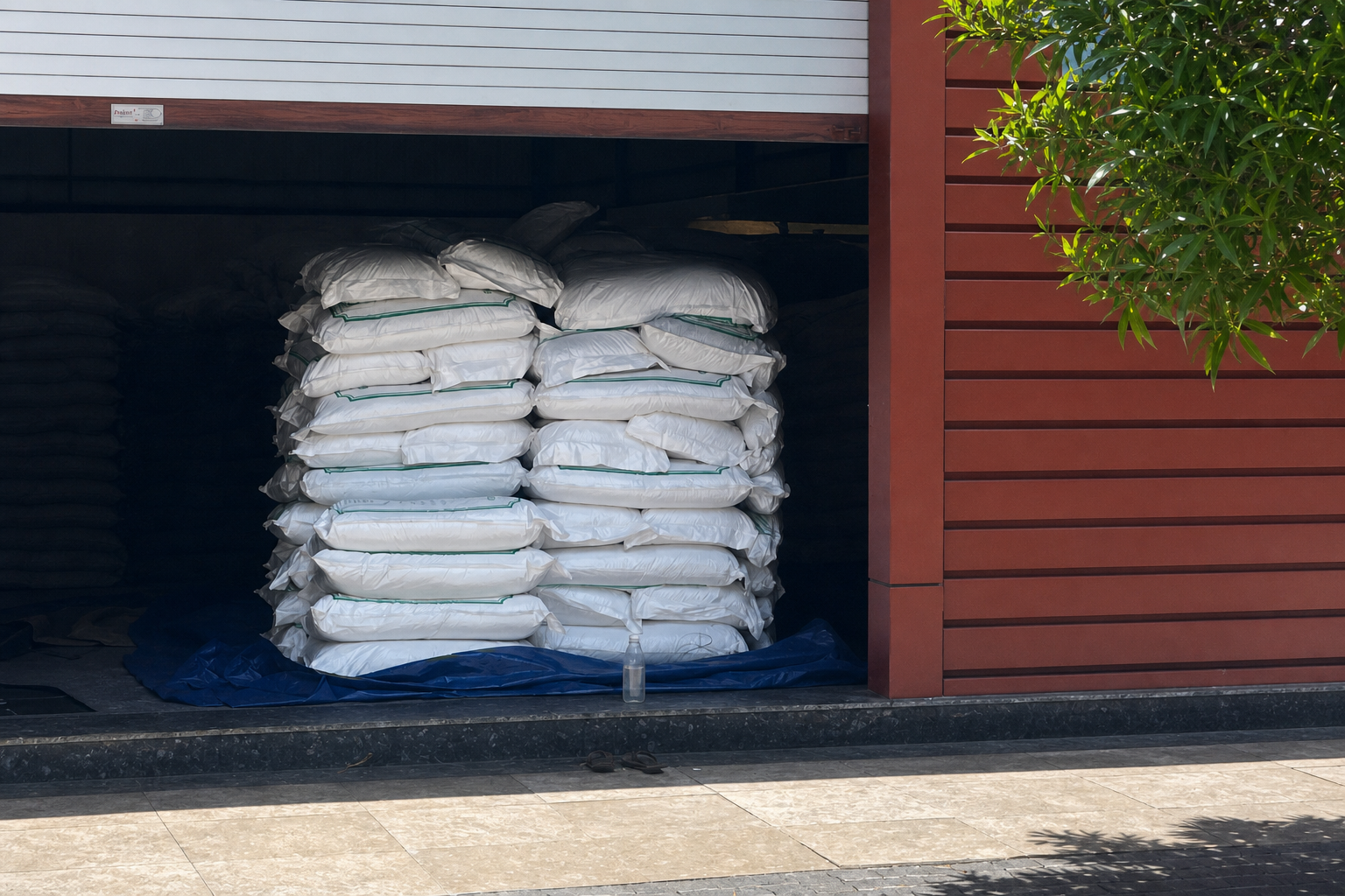 Bulk sacks staged at partner warehouse doorway